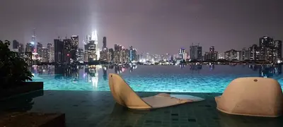 a swimming pool with a view of a city at night at Datum Jelatek Residences Royalty Luxury Apartment, Walking Distance To LRT, Gleneagles KL & KLCC in Kampong Datok Keramat
