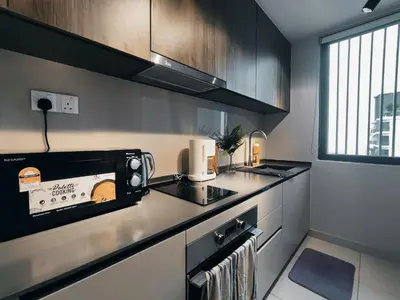 a kitchen with a counter top with a toaster oven at Datum Jelatek Residences Royalty Luxury Apartment, Walking Distance To LRT, Gleneagles KL & KLCC in Kampong Datok Keramat