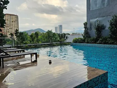 a swimming pool on the side of a building at Neu Suites in Kuala Lumpur