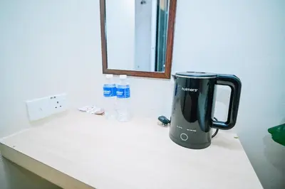 a blender sitting on a counter in a room at Swing & Pillows - My Home Hotel Wangsa Maju in Kuala Lumpur