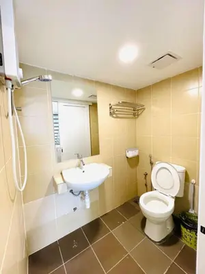 a bathroom with a toilet and a sink at Cozy home in city center with free parking -1C in Kuala Lumpur