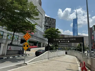 a street sign on a sidewalk in a city at Cozy home in city center with free parking -1C in Kuala Lumpur