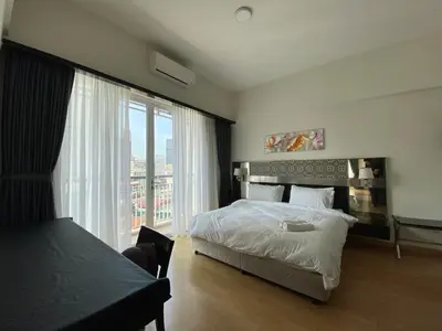 a bedroom with a bed and a large window at Couple Suite For Bukit Bintang S/R in Kuala Lumpur