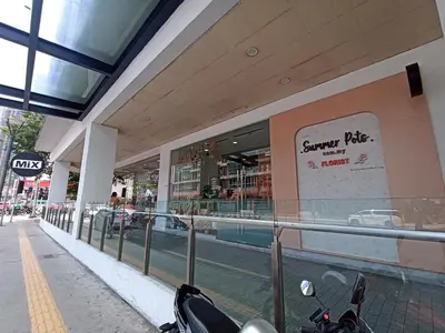 a scooter parked in front of a shopping mall at D'Majestic Place in Kuala Lumpur