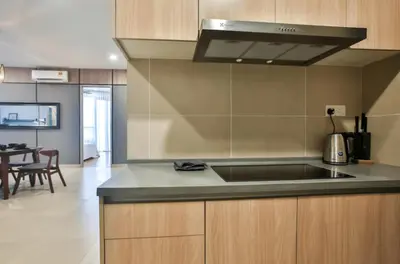 a kitchen with a sink and a counter top at KL Gateway Residences in Kuala Lumpur