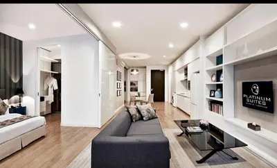 a living room with a couch and a table at The Platinum Kuala Lumpur KLCC By Garden Suites in Kuala Lumpur