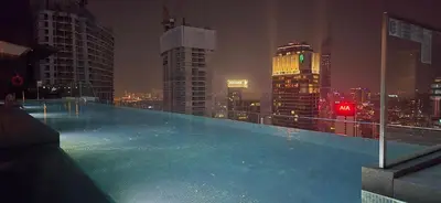 a swimming pool on top of a building with a city skyline at Imperial Suites KLCC in Kuala Lumpur
