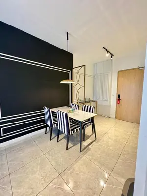 a dining room with a table and chairs at Axon Suite Premium KL in Kuala Lumpur