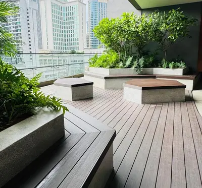 a balcony with benches and plants in a building at Axon Suite Premium KL in Kuala Lumpur