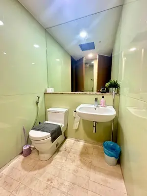 a bathroom with a toilet and a sink at 2bedroom SOHO SUITE KLCC View by Homeizing in Kuala Lumpur