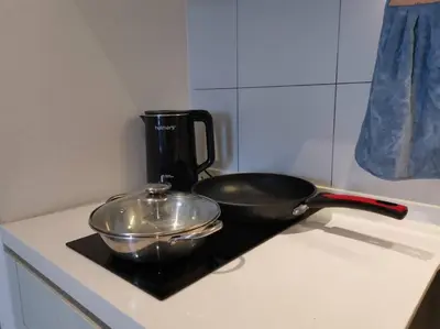 a frying pan sitting on top of a stove at Chambers A Studio Flat, KLCC & KL Tower ,view in City in Kuala Lumpur