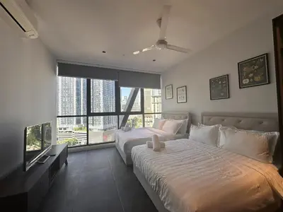 a bedroom with a large bed and a large window at Borderless Swimming Pool - Invincible Twin Towers View - Free WiFi in Kampong Gombak Utara