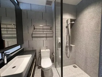 a bathroom with a toilet and a sink and a shower at Borderless Swimming Pool - Invincible Twin Towers View - Free WiFi in Kampong Gombak Utara