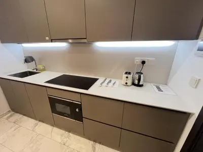a kitchen with a sink and a counter top at Eaton Residence KLCC By HM Costa Doro in Kuala Lumpur