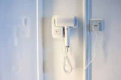 a phone in the corner of a room at Urban KL Gem Perfect Getaway High Speed 100Mbps in Kuala Lumpur