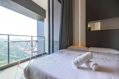 a bedroom with a bed and a large window at Urban KL Gem Perfect Getaway High Speed 100Mbps in Kuala Lumpur