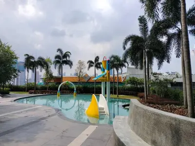 a swimming pool with a slide in a resort at Conveniently Located Trion KL Premium Amenities in Kuala Lumpur