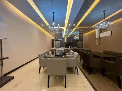 a dining room with chairs and a dining table at The Dorsett Residence Service Suite Bukit Bintang KL in Kuala Lumpur