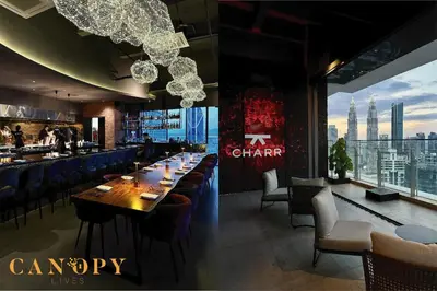 a dining room with a long table and blue chairs at The Manor Serviced Residence by Canopy Lives in Kuala Lumpur