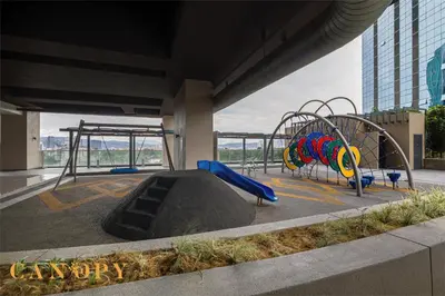 a playground with a slide in a building at The Manor Serviced Residence by Canopy Lives in Kuala Lumpur