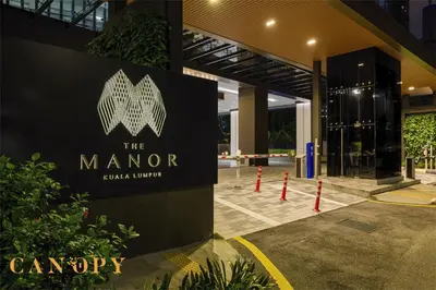 a sign for the manor at a building at The Manor Serviced Residence by Canopy Lives in Kuala Lumpur