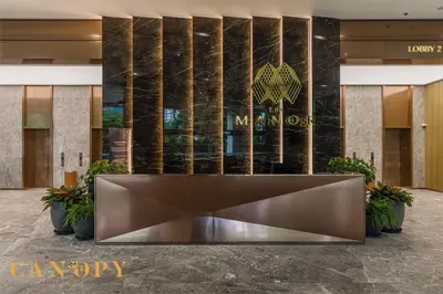 a lobby of a luxury hotel with a reception desk at The Manor Serviced Residence by Canopy Lives in Kuala Lumpur