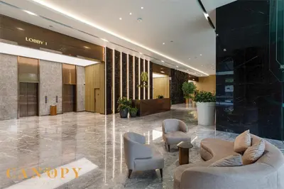a lobby with couches and chairs in a building at The Manor Serviced Residence by Canopy Lives in Kuala Lumpur