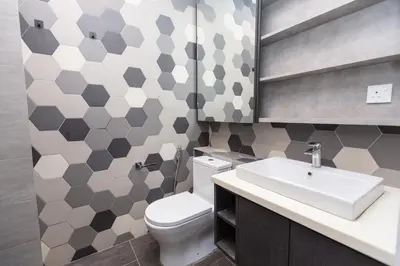 a bathroom with a white toilet and a sink at Ceylonz Suites near KLCC& KL Tower by My Trip & My Stay in Kuala Lumpur