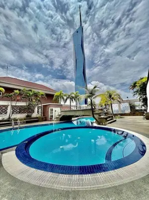 a large blue swimming pool in front of a building at 19-16 Casa Mutiara-Sweet Home city view in Kuala Lumpur