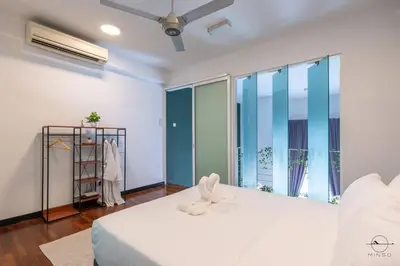 a bedroom with a white bed and large windows at Scott Garden #23th KLCC view #MidValley Megamall in Kuala Lumpur