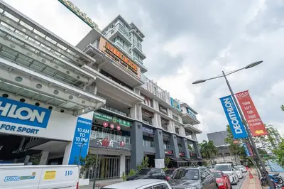 a building with cars parked in a parking lot at Scott Garden #23th KLCC view #MidValley Megamall in Kuala Lumpur