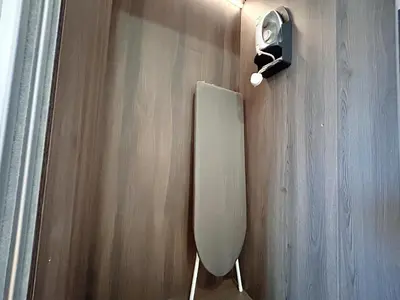 a bathroom with a mirror and a light on a wall at Chambers Residence by Manhattan Group in Kuala Lumpur