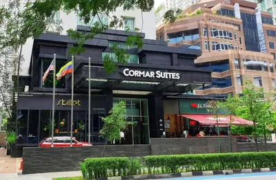 a restaurant with a flag in front of a building at KLCC Room in Kuala Lumpur