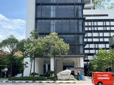 a red van parked in front of a tall building at ContiNeW Pudu nr Ikea Cheras 2Br-6pax-1park-Wi-fi in Kuala Lumpur
