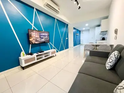 a living room with a couch and a flat screen tv at ContiNeW Pudu nr Ikea Cheras 2Br-6pax-1park-Wi-fi in Kuala Lumpur
