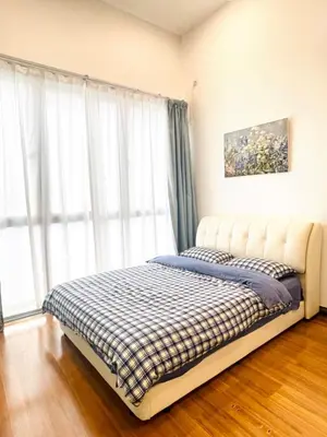 a bed in a room with a large window at Cozy home in city center with free parking -1D in Kuala Lumpur