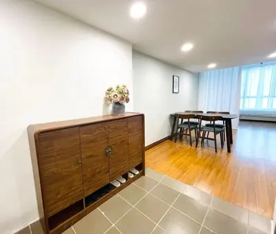 a living room with a dresser and a dining room at Cozy home in city center with free parking -1D in Kuala Lumpur