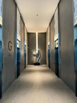 a hallway with a statue in the middle of a building at M Vertica Residence in Kuala Lumpur