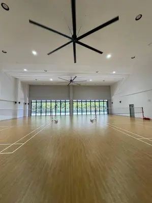 a large clock on the ceiling of a room with a wooden floor at M Vertica Residence in Kuala Lumpur