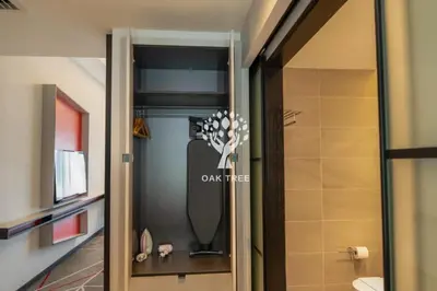 a bathroom door with a sign on the wall at The OAK SUITE AT Menara M101 KL in Kuala Lumpur