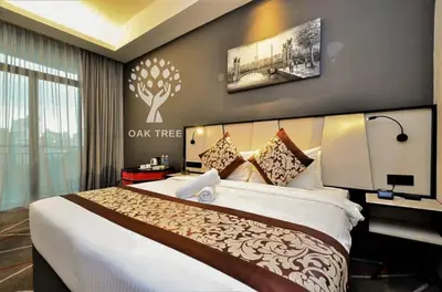 a bedroom with a large bed in a room at The OAK SUITE AT Menara M101 KL in Kuala Lumpur