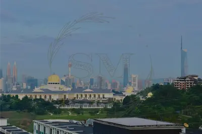 a city skyline with a large sign in the background at Dorsett Residences Hartamas in Kuala Lumpur