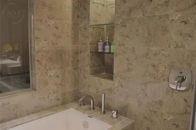 a bathroom with a sink and a shower at Dorsett Residences Hartamas in Kuala Lumpur