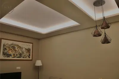a room with three lights hanging from a ceiling at Dorsett Residences Hartamas in Kuala Lumpur