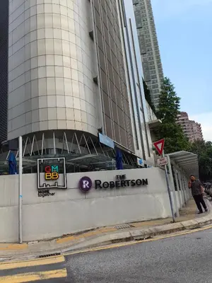 a building with a sign in front of it at The Robertson R9 Walk to Jalan Alor Street Bukit Bintang Pavilion 7 pax 2R1B in Kuala Lumpur