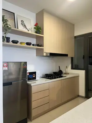a kitchen with a stove and a microwave at The City Edge United Point in Kuala Lumpur