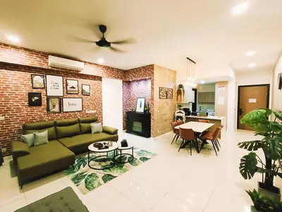a living room with a couch and a brick wall at 7 Kuala Lumpur City for 4 to 12 PAX of 4 BEDROOMS and 3 BATHROOMS near KLCC in Kuala Lumpur