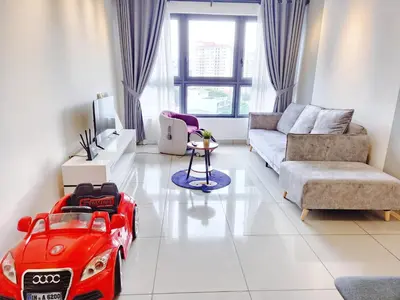 a living room with a red toy car on the floor at Luxury 4 Bedroom Suite at Cheras Maluri MRT in Kuala Lumpur