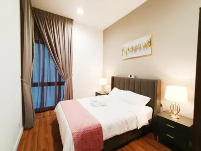 a hotel room with a bed and a window at 8 Kuala Lumpur City for 4 to 10 PAX of 4 BEDROOMS and 3 BATHROOMS near KLCC in Kuala Lumpur
