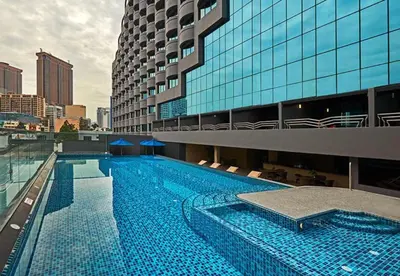 a large swimming pool in front of a building at SG Residence Kuala Lumpur by Fortune Suites in Kuala Lumpur